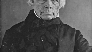 Brustbild in schwarzweiß von dem Philosophen Friedrich Wilhelm Joseph Schelling, der den Betrachter frontal ansieht.