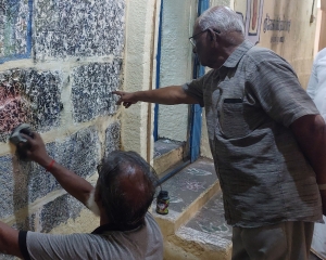 Babu N. Ramaswamy and K. Vijayavenugopal documenting an inscription in the Yathoktakārī temple
