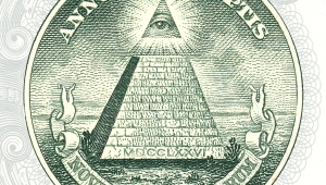 Siegel mit Pyramide, aud deren Spitze das allsehende Auge ist. Oben steht "Annuit Coeptis", unten  in Spruchband "Novus ordo seclorum"